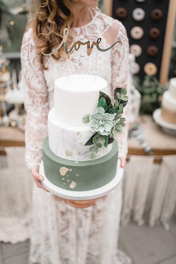 romantic sage green and white wedding cakes with glitter accents