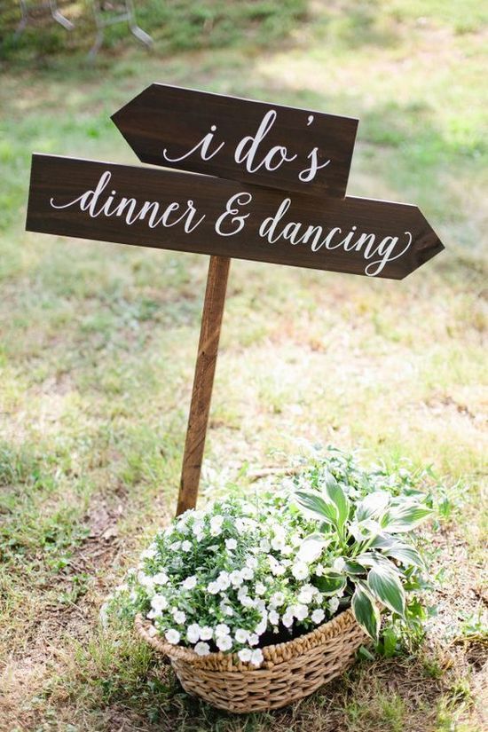 Rustic wedding sign and wildflowers wedding decor