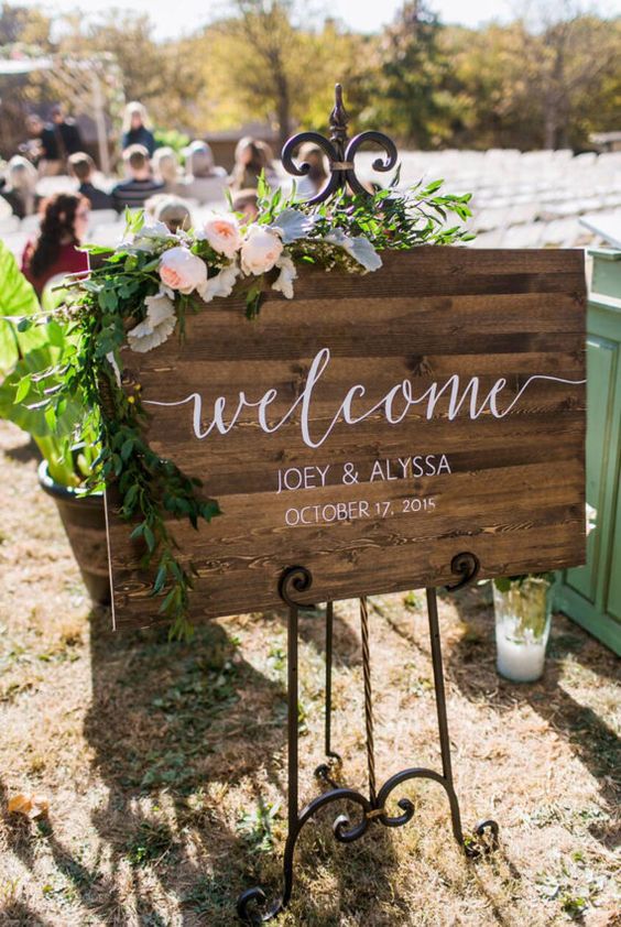 rustic wooden welcome sign