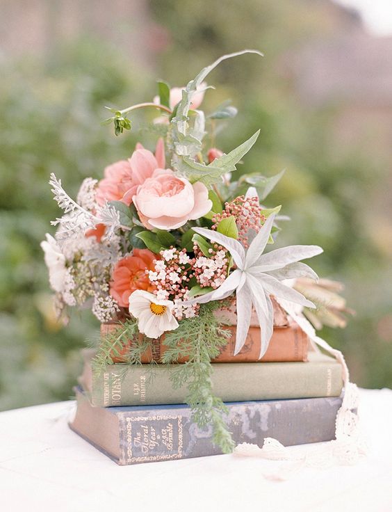 vintage flowers on book wedding centerpiece