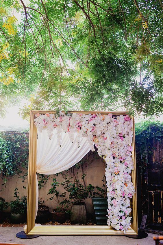 Golden Wedding Arch Draped With Florals