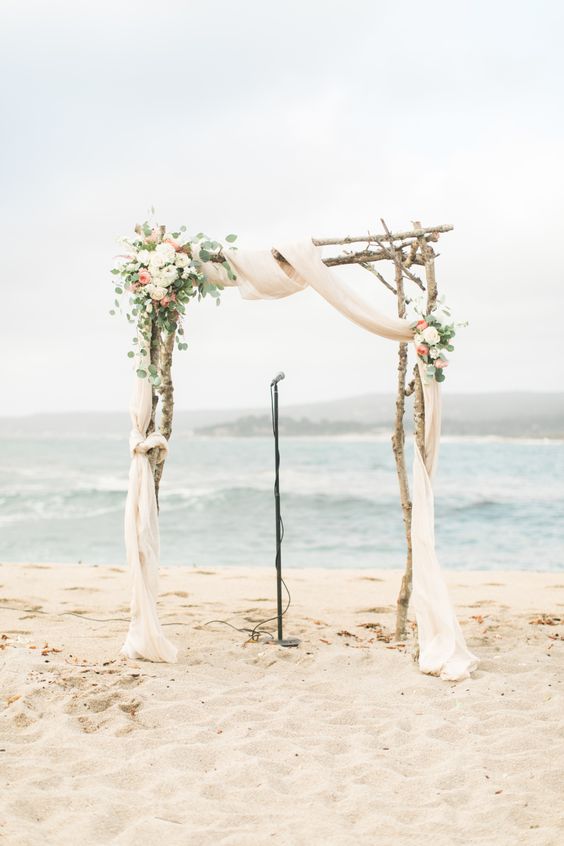 Rustic beach wedding arch via Wai Reyes