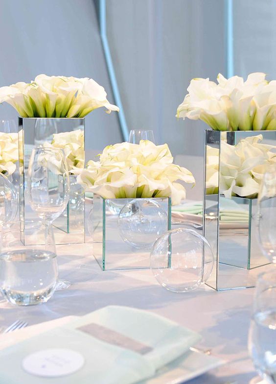The architectural shape and variety of colors make calla lilies well suited for anything from a modern ballroom reception to an intimate ceremony on the beach