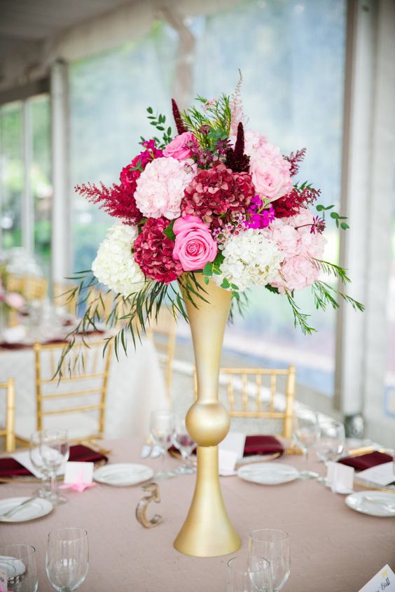 Towering pink wedding floral centerpiece via Dana Cubbage