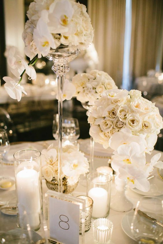 White wedding reception centerpiece idea via Pen Carlson Photography