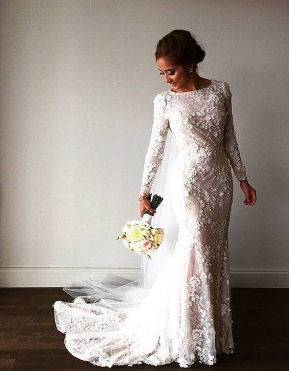 beautiful modest lace wedding dress with long sleeves Photo via Popsugar