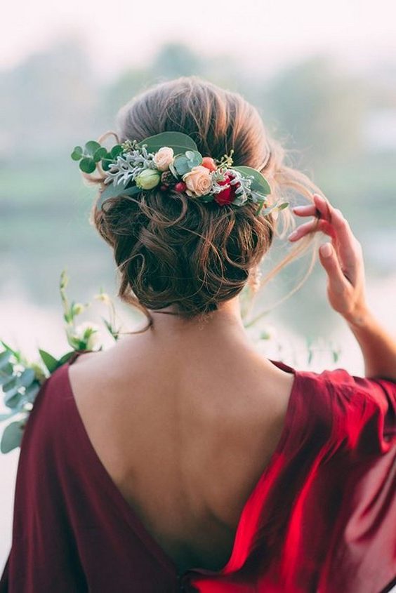 floral adorned updo wedding hairstyle