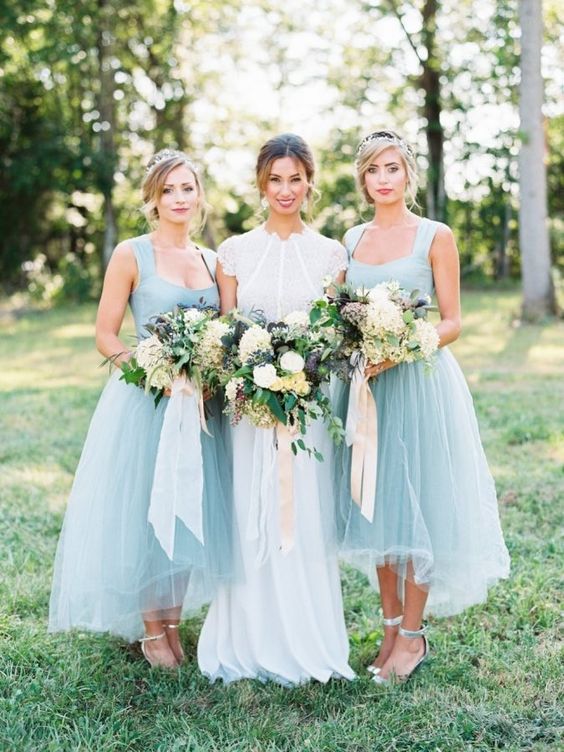 light blue tulle high low bridesmaid dresses via Krista A. Jones