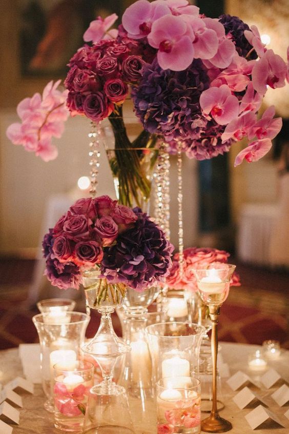 pink and purple wedding centerpiece idea via Judy Pak Photography