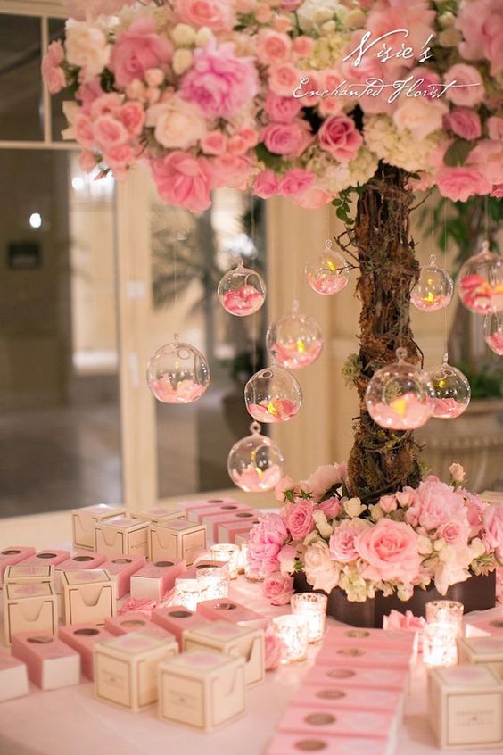 pink wedding centerpiece idea via Nisie’s Enchanted Florist