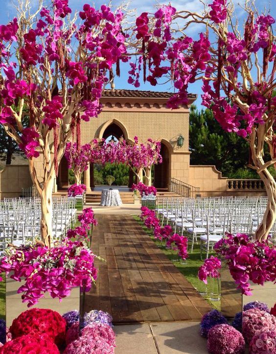 purple wedding ceremony aisle idea via Crown Weddings and Events