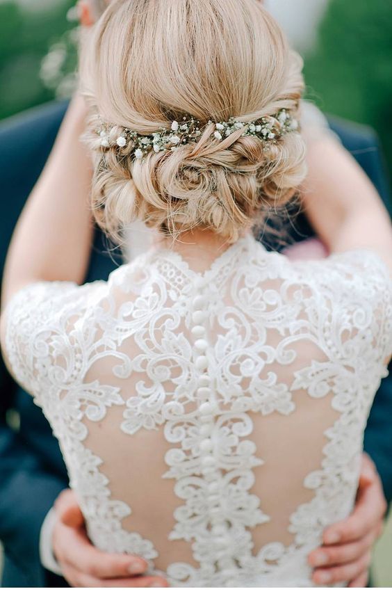 twisted wedding updo hairstyle with baby’s breath