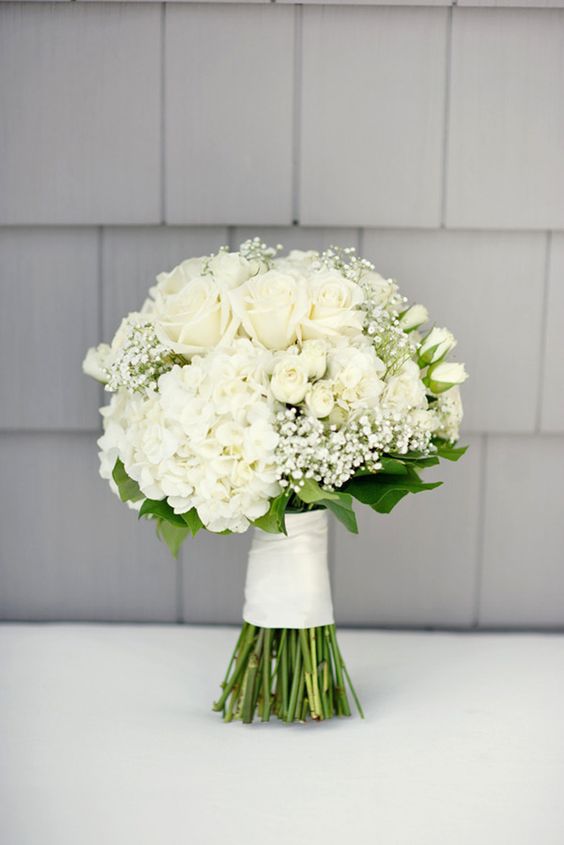 An all-white wedding bouquet is a staple of any gorgeous wedding