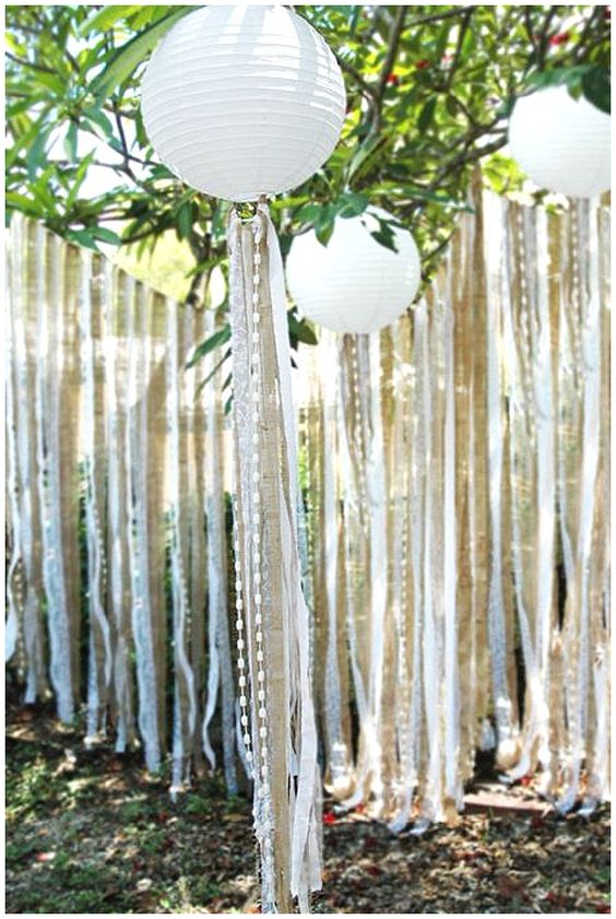 Hanging paper lanterns and ribbon, burlap, lace and bead streamers