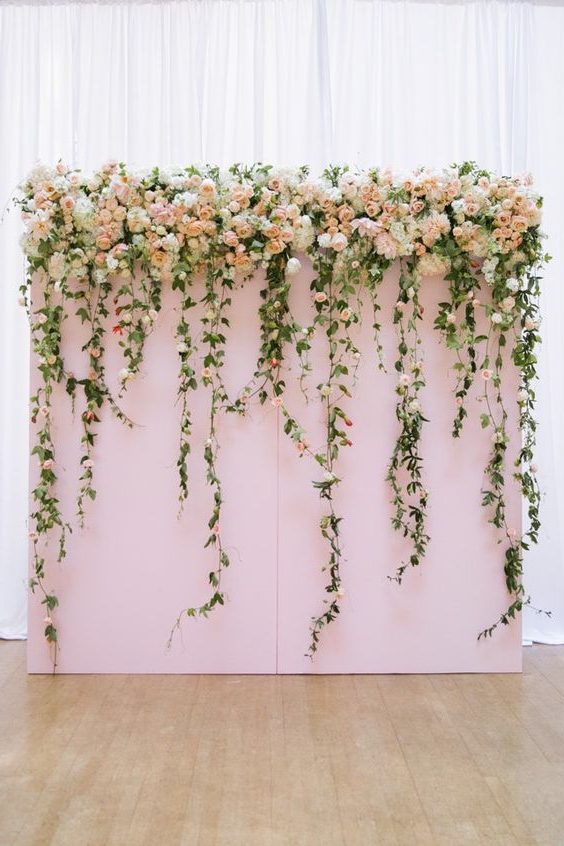 lush floral wedding backdrop for indoor wedding ceremony
