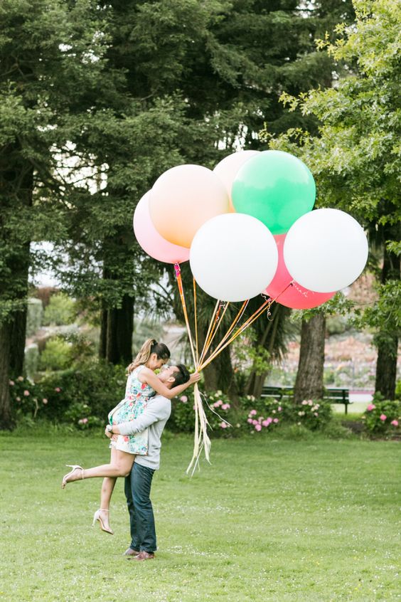 whimsical wedding reception decor look with giant balloons and twinkly lights
