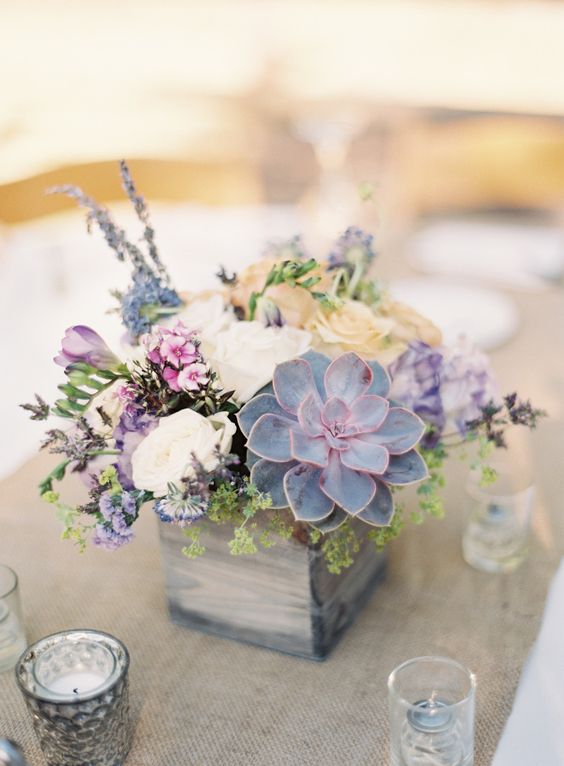 Colorful succulent floral arrangement wedding centerpiece