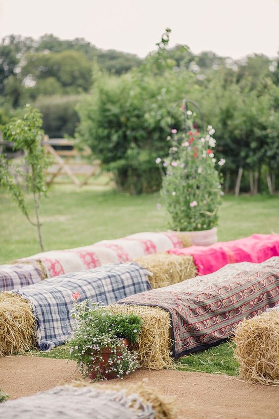 Hay bales as seating for the outdoor wedding ceremony