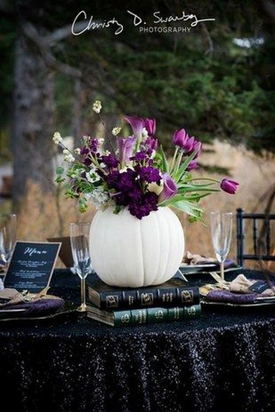 Use white pumpkins, gold skulls, and black sequins for a chic look