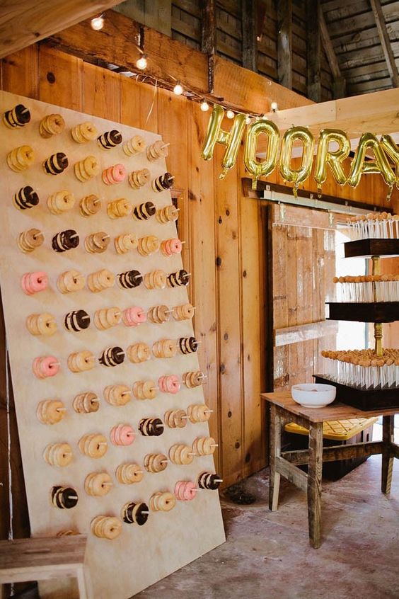 Wedding reception donut wall and cake pop station