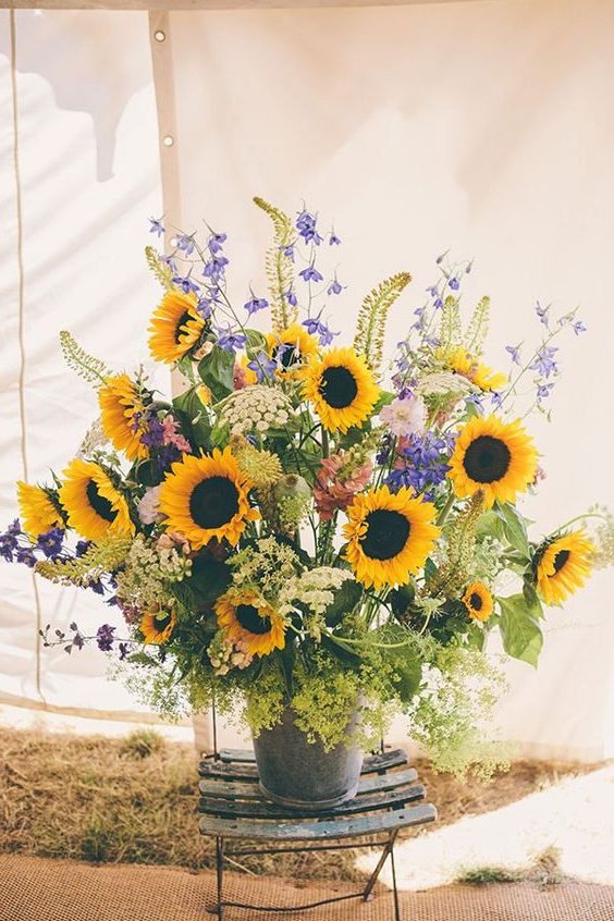 bucket of sunflowers and wildflowers wedding centerpiece