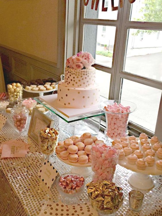 sweets table at a pink and gold wedding