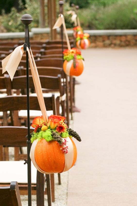 Pumpkin aisle wedding decor for an October wedding