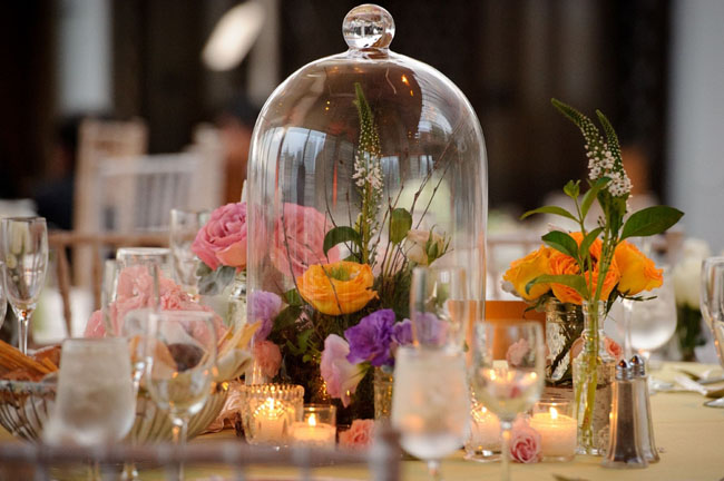 pink flowers in bell jar wedding centerpiece