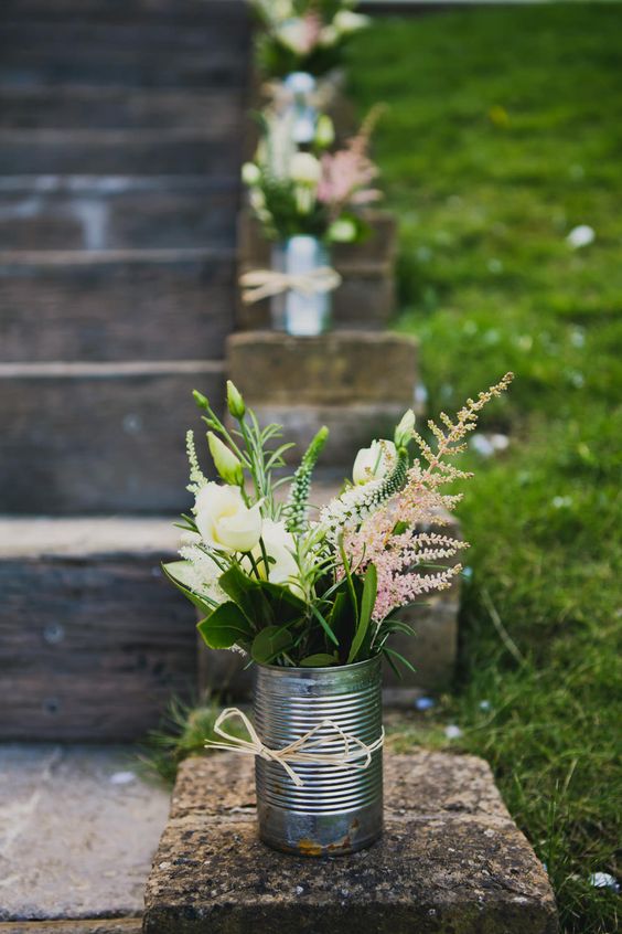 white and pink flowers tin can wedding decor