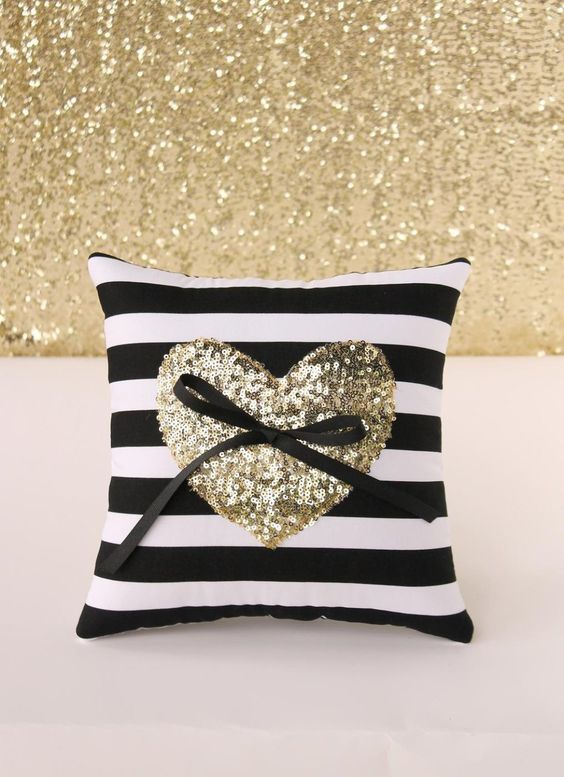 Black and white striped ring pillow with gold sequin heart