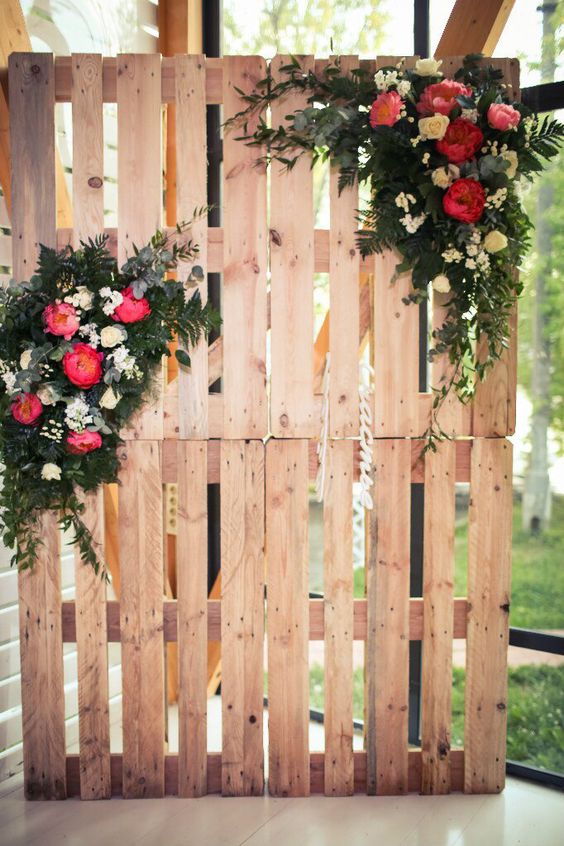 Botanic wooden pallets wedding photobooth with bright peonies