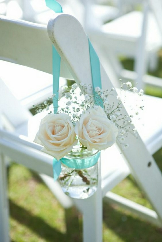 roses in mason jars with aqua ribbon wedding chair decoration ideas for beach weddings