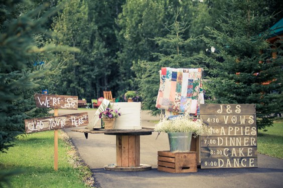 wedding display with pallet signs and old quits