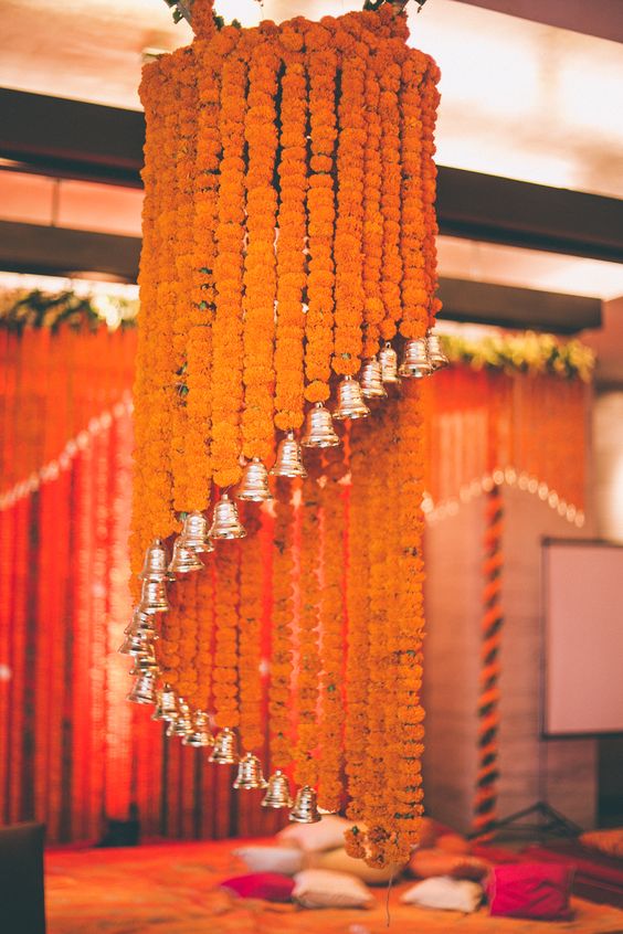 floral chandelier made of orange marigold and bells