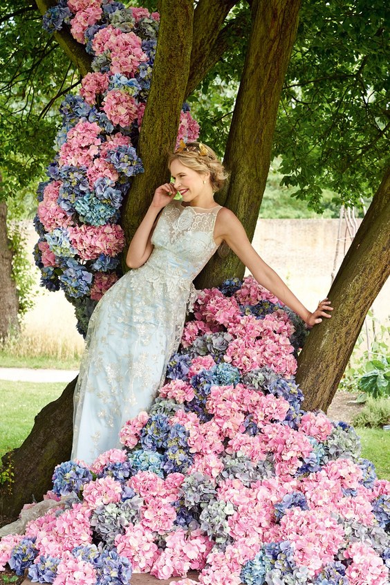 pink and blue hydrangeas covered tree wedding backdrop