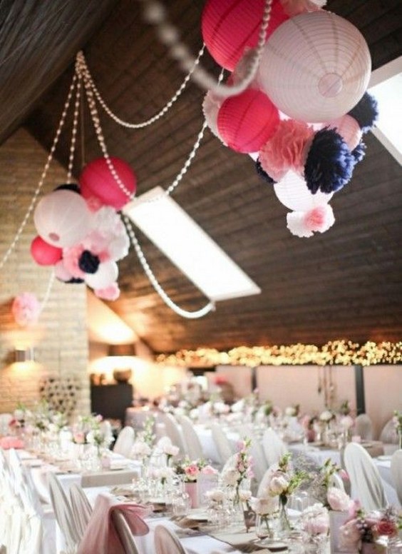 pink and navy paper pom poms wedding decor