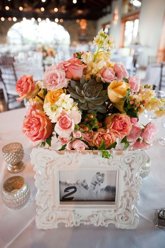 pink floral wedding reception centerpiece with pops of yellow