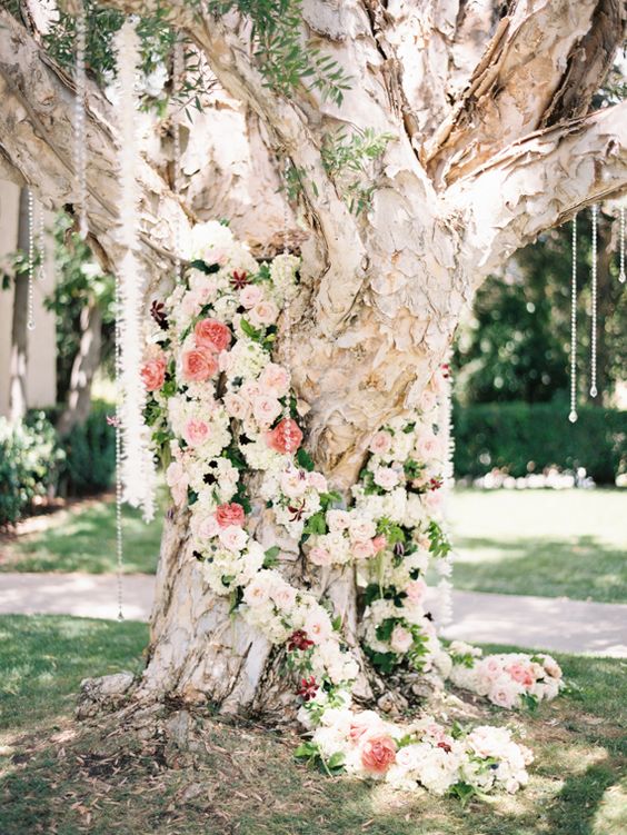 pink wedding flowers and tree wedding backdrop