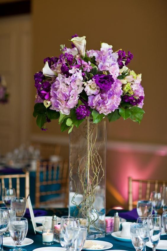 purple floral wedding reception tall wedding centerpiece