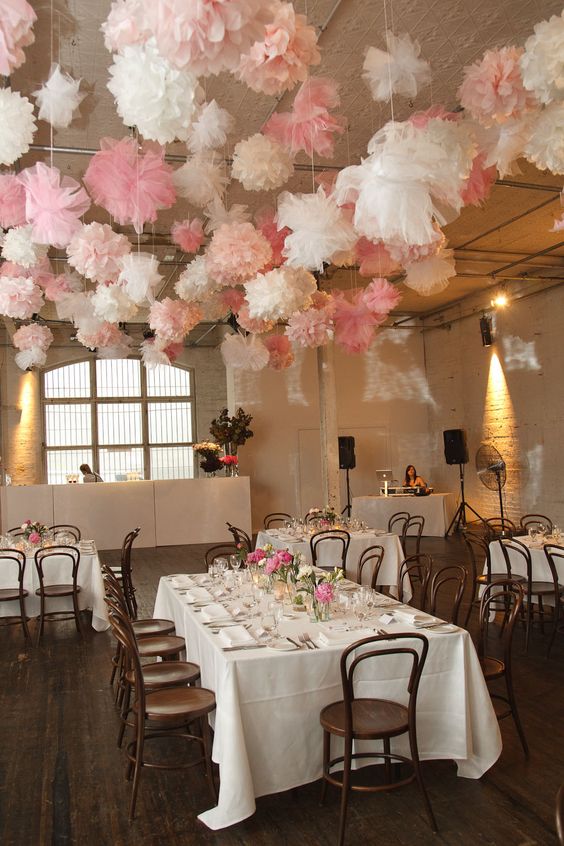 white and pink pom poms wedding decor
