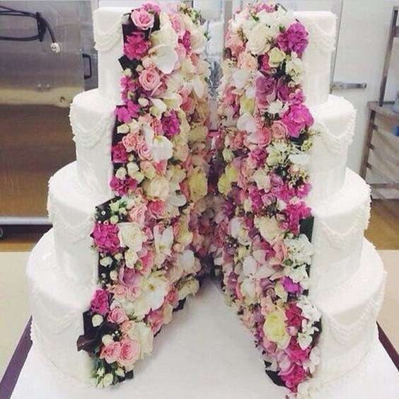 white wedding cake with fresh flowers