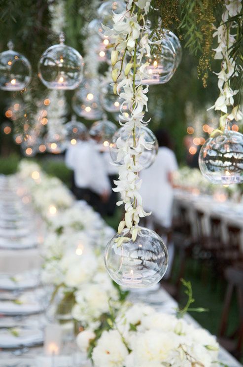 hanging crystals and glass spheres filled with votives