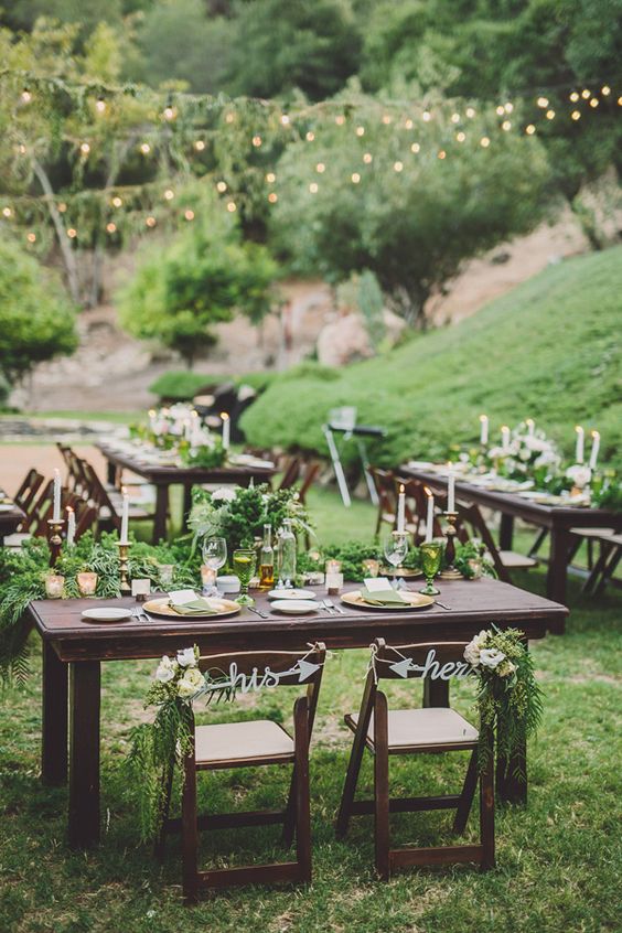 wedding reception centrepiece with greenery via life photography