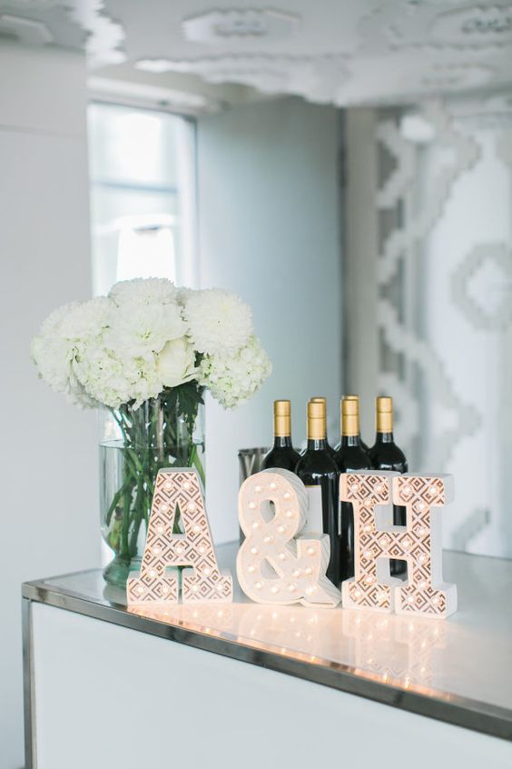 white hydrangeas newlywed initials and wine