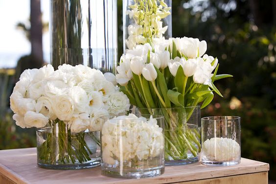 Two circular vases from Z Gallerie hold a handful of gorgeous white tulips