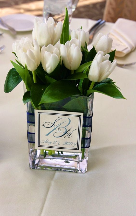 all white tulip wedding centerpiece for spring wedding