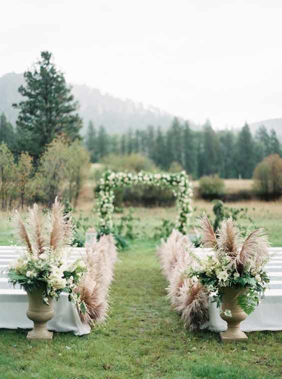 outdor pampas grass wedding aisle decor via Rebecca Hollis Photography