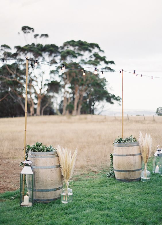 rustic wine barrels and pampas grass wedding alter via Jose Villa Photography