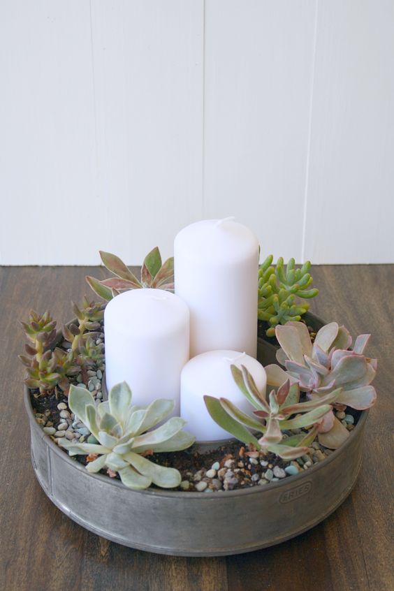 succulent and candles wedding centerpiece