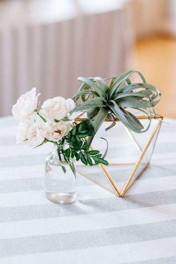 Seaglass and air plants wedding centerpiece via Sarah Kate